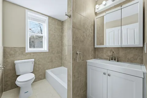 a bathroom with a toilet a sink and a bathtub