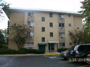 2226 South Goebbert Road, Unit 365 Arlington Heights, IL 60005 - Photo 1 of 1 a front view of a house with yard and parking