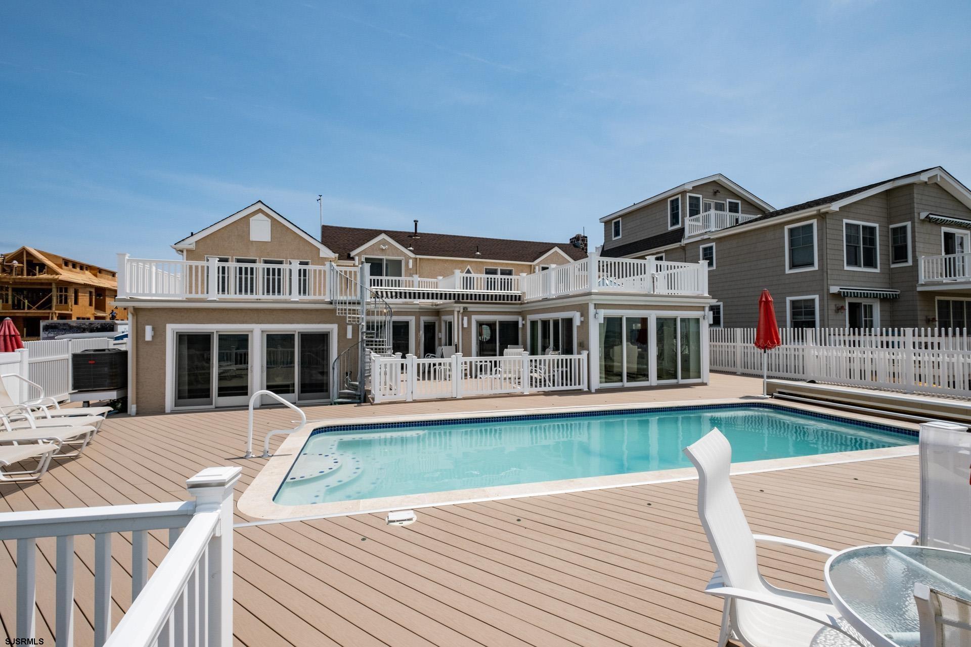232 Bay Road Ocean City, NJ 08226 - Photo 6 of 32 a front view of a house with a yard table and chairs