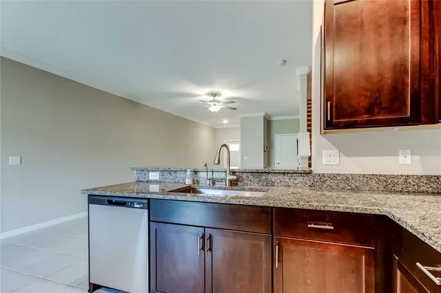 a kitchen with a refrigerator and a sink