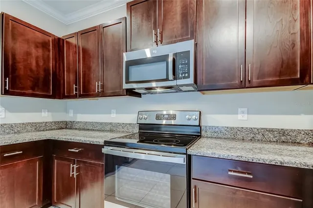 a white toilet sitting next to a shower