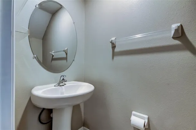a white toilet sitting next to a shower