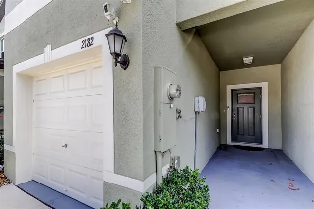 a view of a kitchen with a sink and a refrigerator