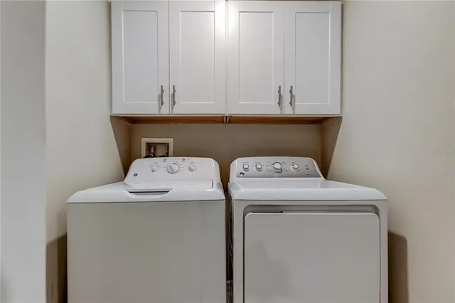 an empty room with a fan and a fan