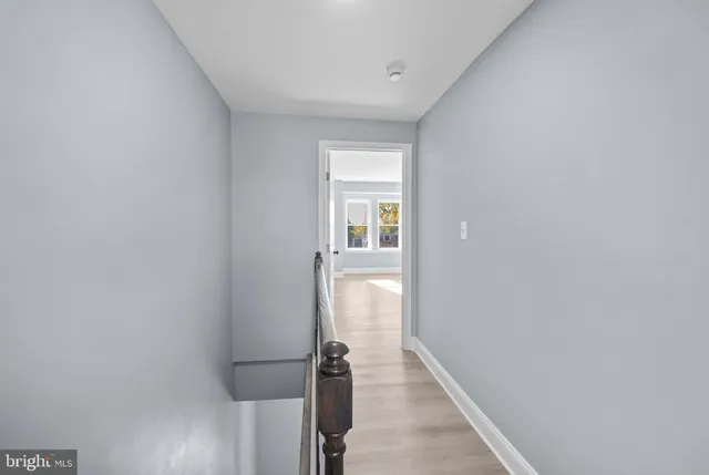 a view of a hallway with a white walls