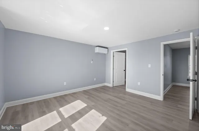 a view of an empty room and glass door