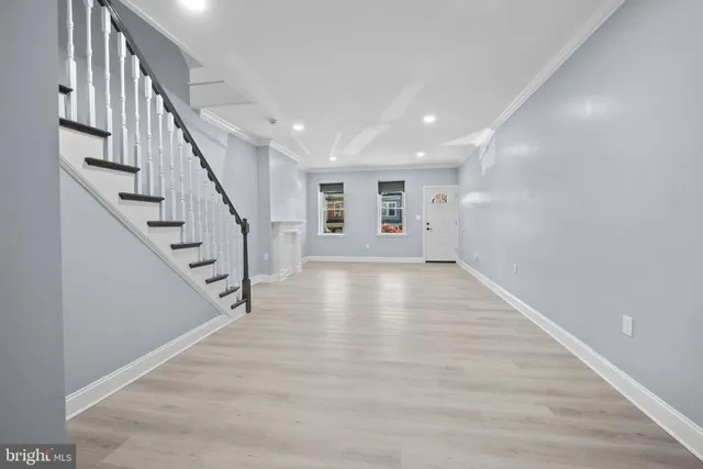 a view of an entryway with wooden floor
