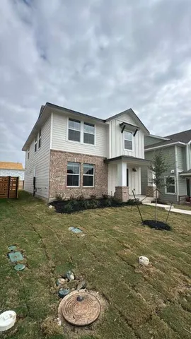 a view of a house with swimming pool and a yard