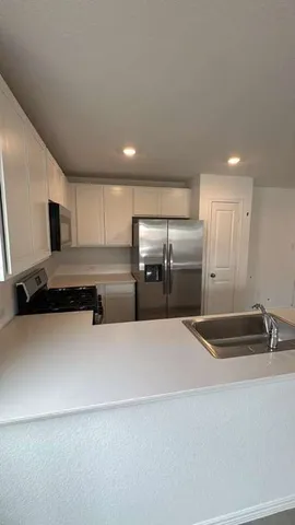 a view of kitchen and windows