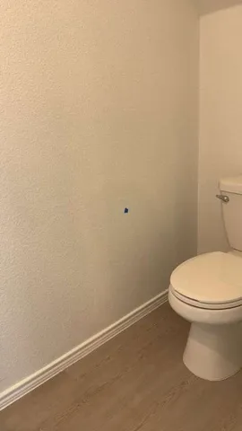 a bathroom with a toilet and a bathtub