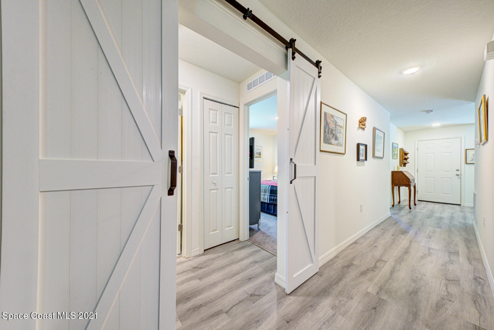 999 Commerce Road Southeast Palm Bay, FL 32909 - Photo 17 of 48 hallway with barn doors