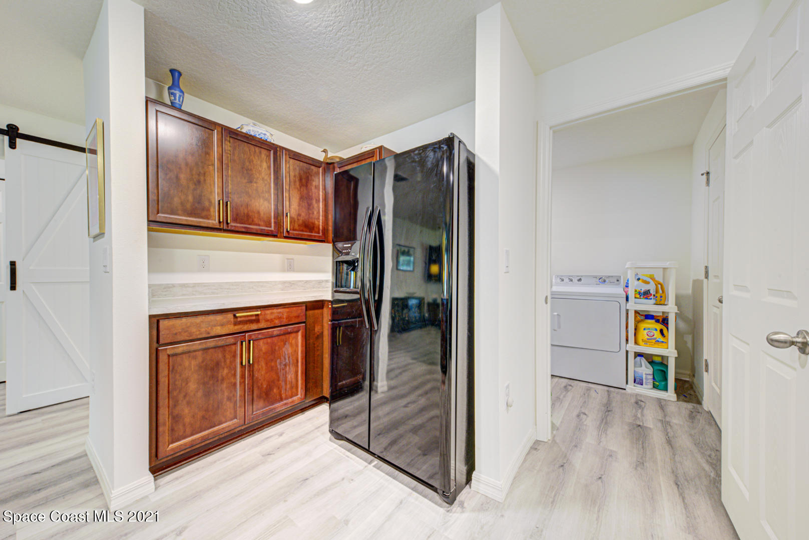 999 Commerce Road Southeast Palm Bay, FL 32909 - Photo 18 of 48 kitchen & laundry room