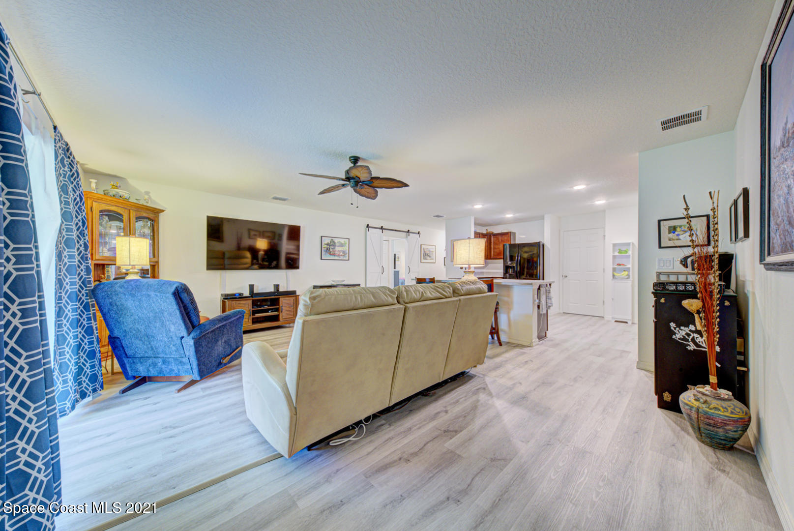 999 Commerce Road Southeast Palm Bay, FL 32909 - Photo 24 of 48 family room with fan