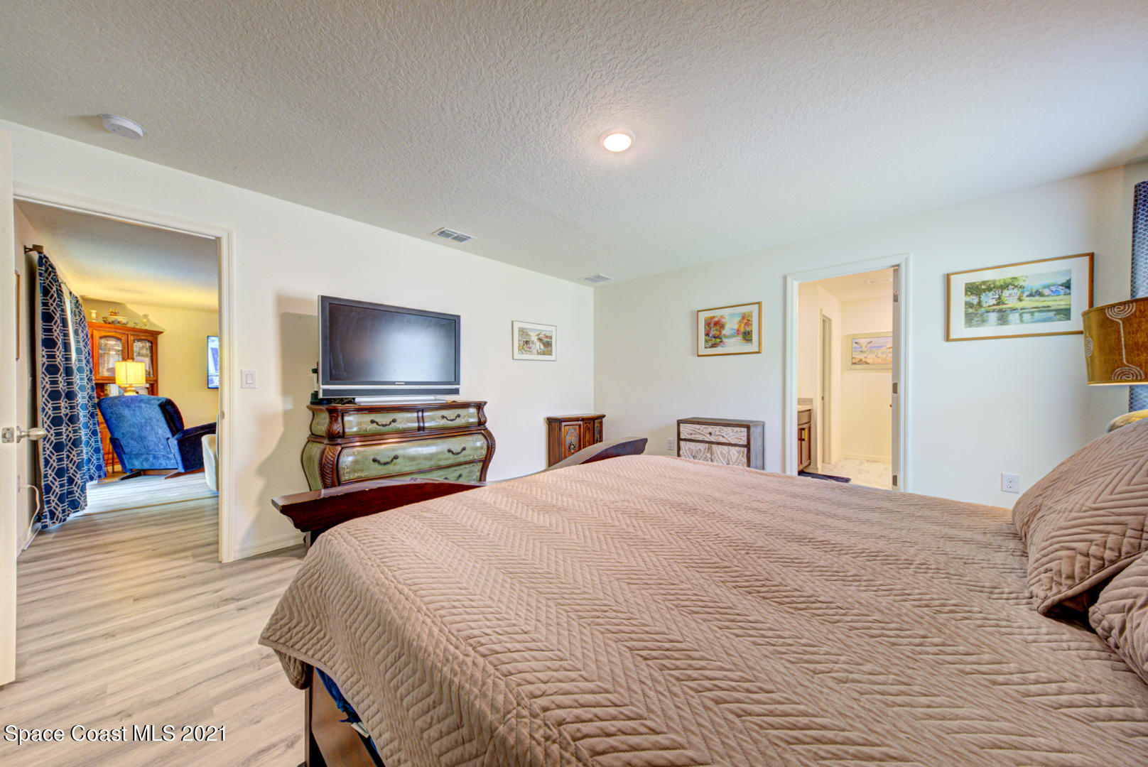 999 Commerce Road Southeast Palm Bay, FL 32909 - Photo 33 of 48 master bedroom with ensuite