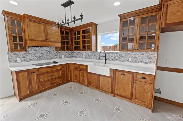 a kitchen with stainless steel appliances granite countertop a sink and cabinets