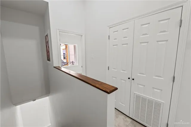 a view of an entryway with wooden floor