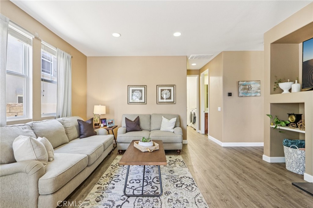19941 Christopher Lane Saugus, CA 91350 - Photo 11 of 34 a living room with furniture and a wooden floor