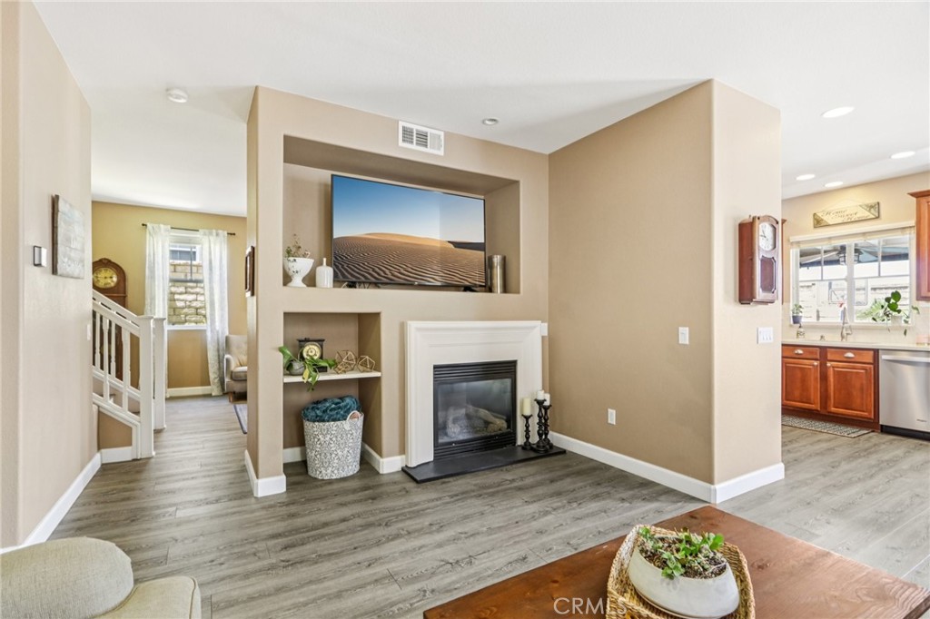 19941 Christopher Lane Saugus, CA 91350 - Photo 12 of 34 a living room with furniture a fireplace and a flat screen tv