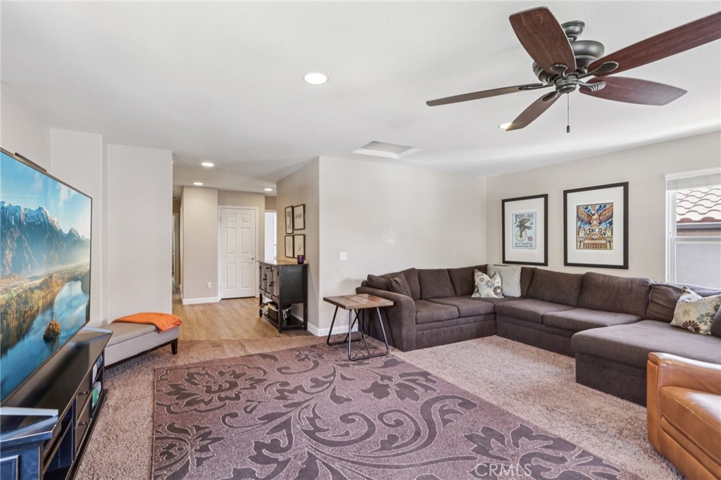 19941 Christopher Lane Saugus, CA 91350 - Photo 14 of 34 a living room with furniture and a flat screen tv