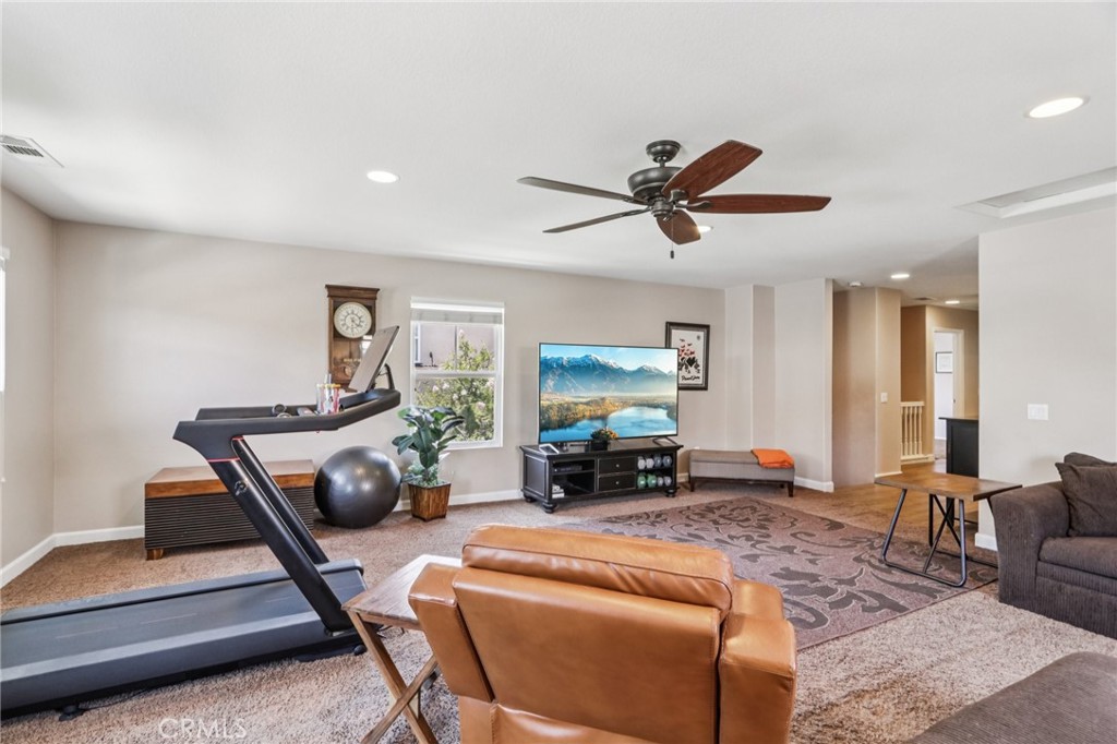 19941 Christopher Lane Saugus, CA 91350 - Photo 15 of 34 a living room with furniture a window and a flat screen tv
