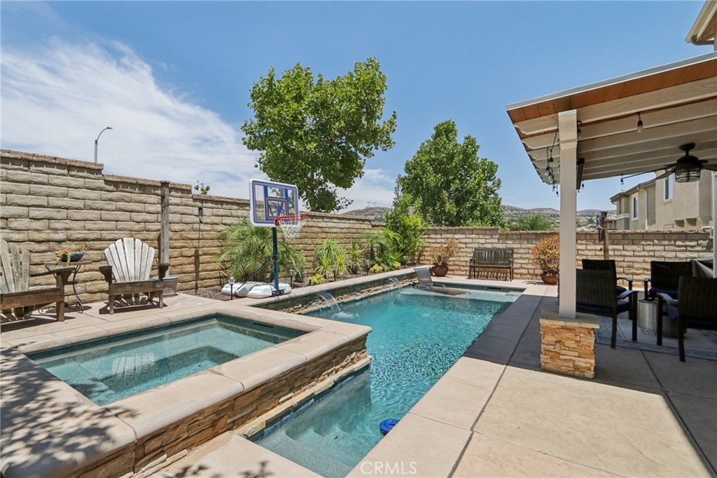19941 Christopher Lane Saugus, CA 91350 - Photo 2 of 34 a view of a swimming pool with a patio