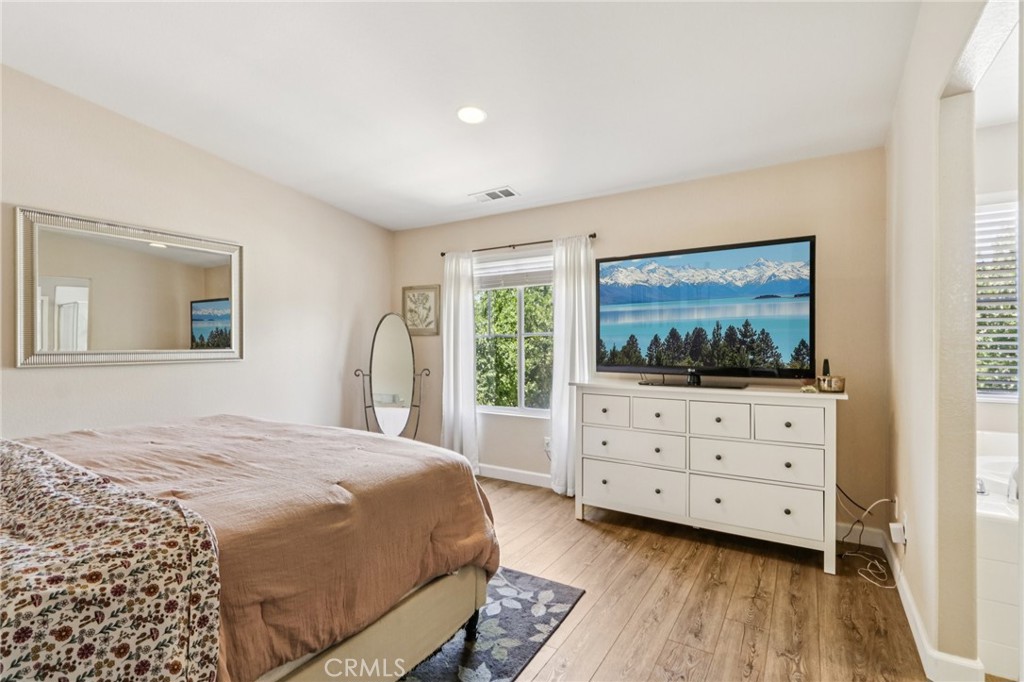 19941 Christopher Lane Saugus, CA 91350 - Photo 22 of 34 a bedroom with a bed and a flat screen tv