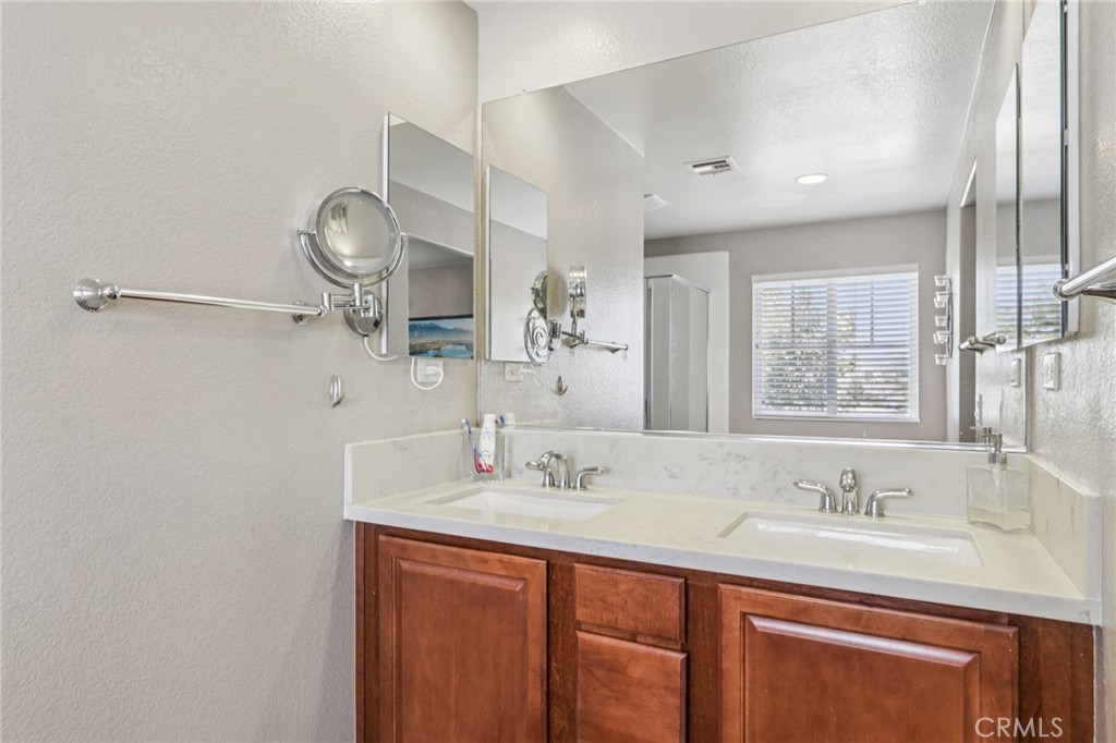 19941 Christopher Lane Saugus, CA 91350 - Photo 24 of 34 a bathroom with a sink double vanity and a mirror