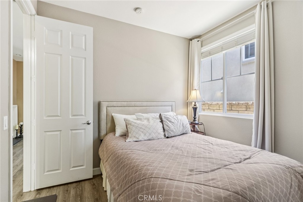 19941 Christopher Lane Saugus, CA 91350 - Photo 25 of 34 a bedroom with a bed and a window