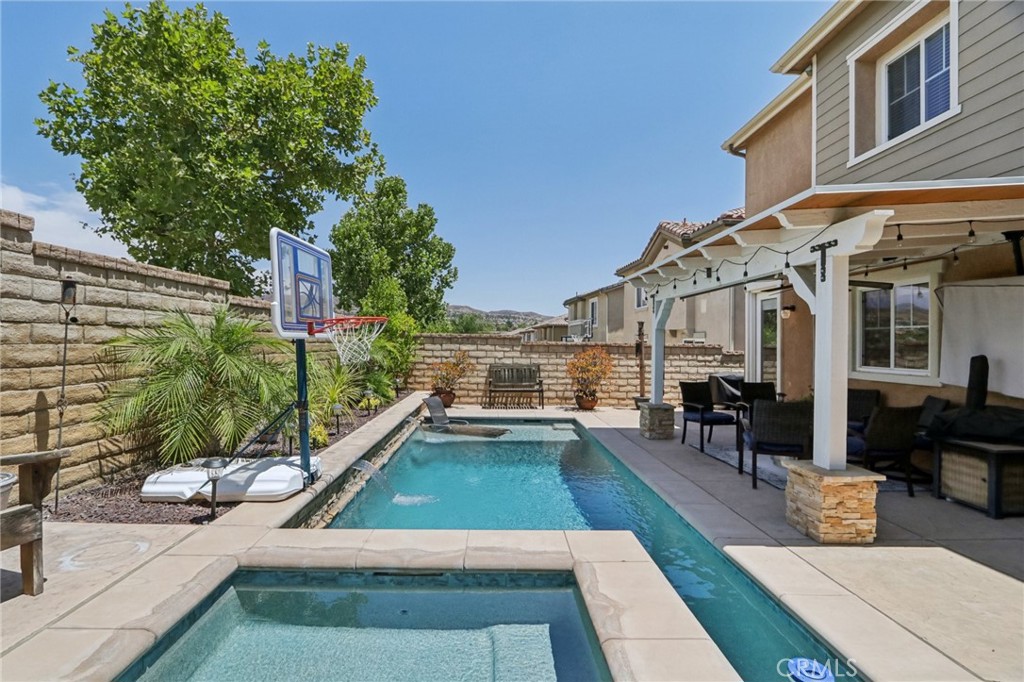 19941 Christopher Lane Saugus, CA 91350 - Photo 31 of 34 a view of a house with swimming pool