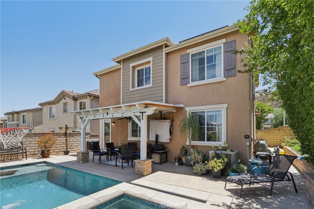 19941 Christopher Lane Saugus, CA 91350 - Photo 32 of 34 a front view of a house with outdoor seating