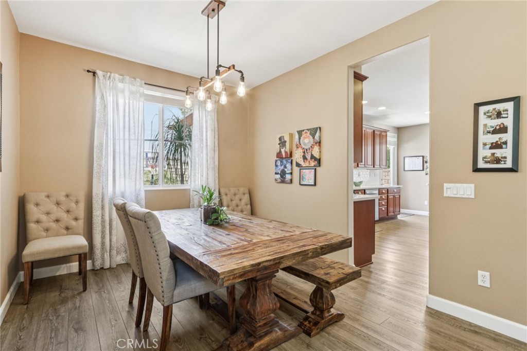 19941 Christopher Lane Saugus, CA 91350 - Photo 8 of 34 a view of a dining room with furniture window and wooden floor