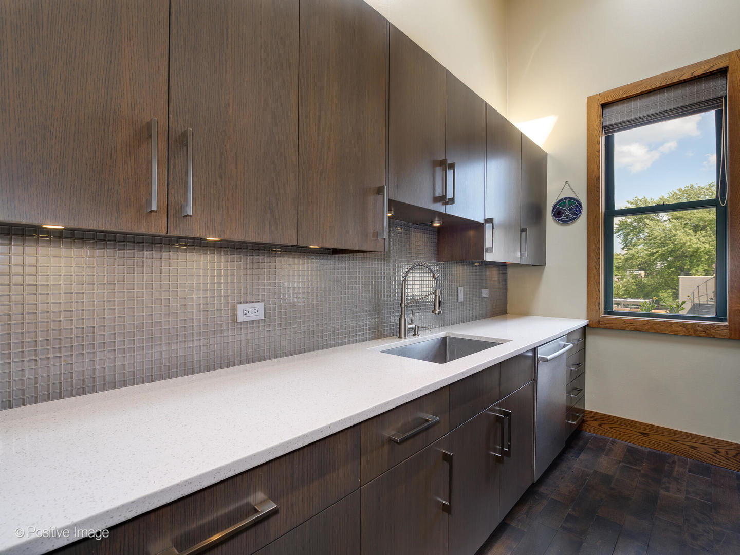 2543 North Racine Avenue, Unit 3N Chicago, IL 60614 - Photo 15 of 25 a kitchen with a sink and cabinets