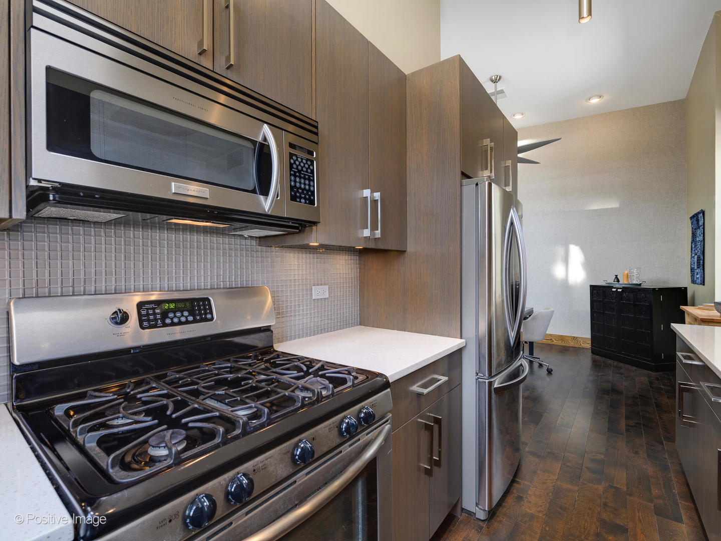 2543 North Racine Avenue, Unit 3N Chicago, IL 60614 - Photo 17 of 25 a kitchen with a stove and a microwave