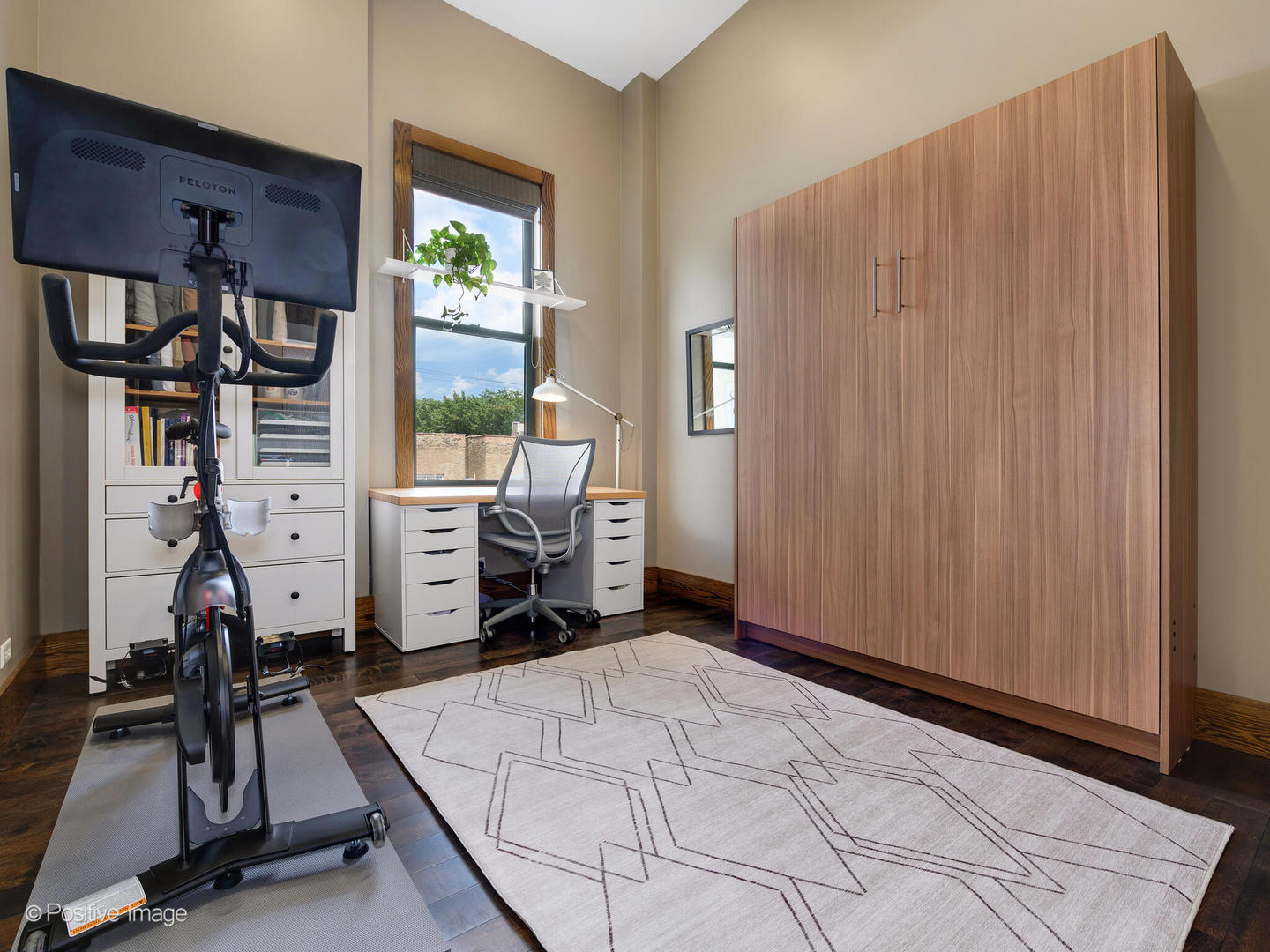 2543 North Racine Avenue, Unit 3N Chicago, IL 60614 - Photo 18 of 25 a room with furniture a window and gym cycle