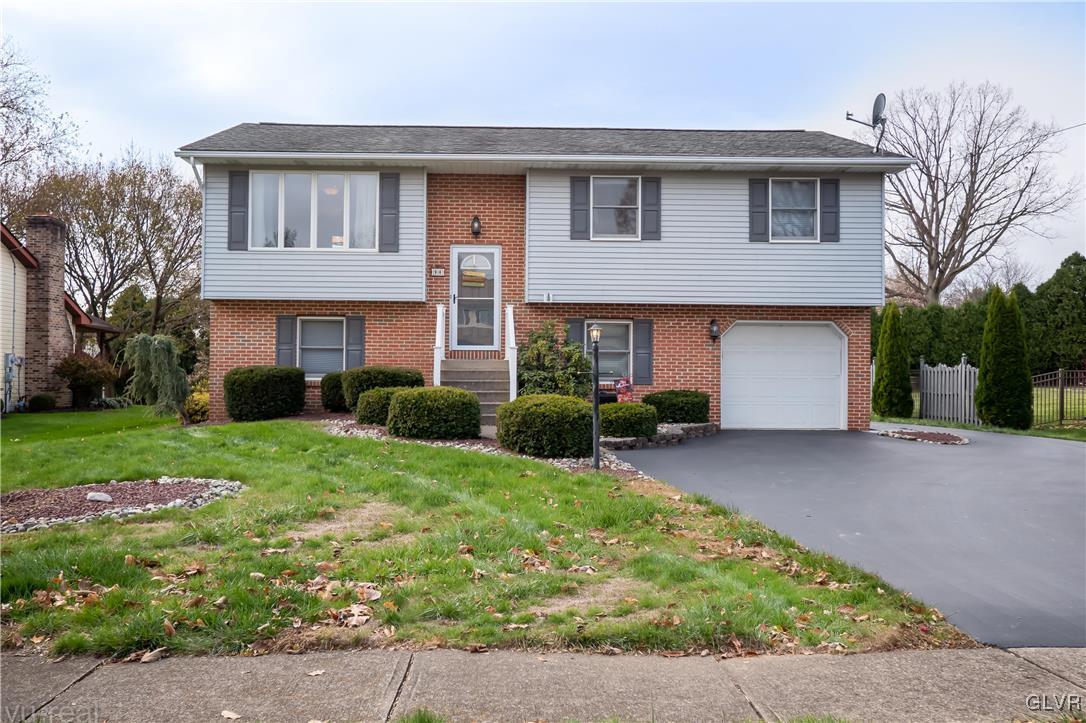 212 Ridgewood Road Easton, PA 18045 - Photo 40 of 44 a front view of a house with a yard and garage
