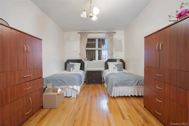 a bedroom with furniture and wooden floor