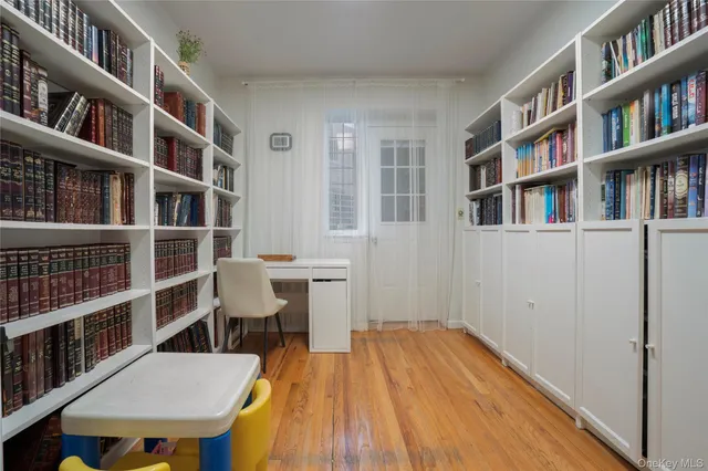 a view of a workspace with furniture and toys