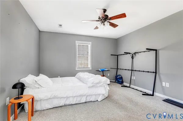 a bed room with a bed and a lamp