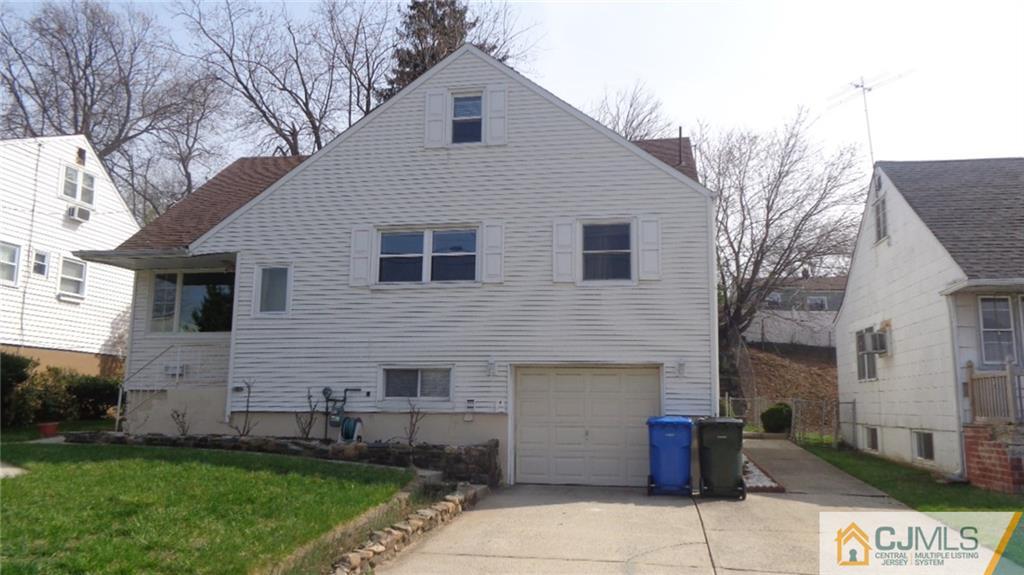 34 Brandywine Road Fords, NJ 08863 - Photo 1 of 19 a front view of a house with a garden