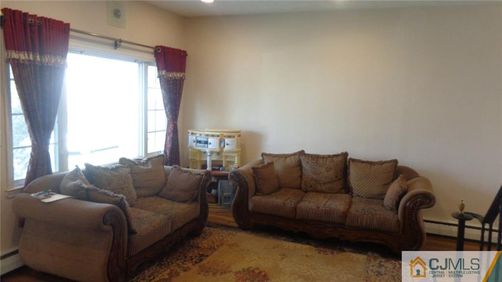 34 Brandywine Road Fords, NJ 08863 - Photo 5 of 19 a living room with furniture and a window