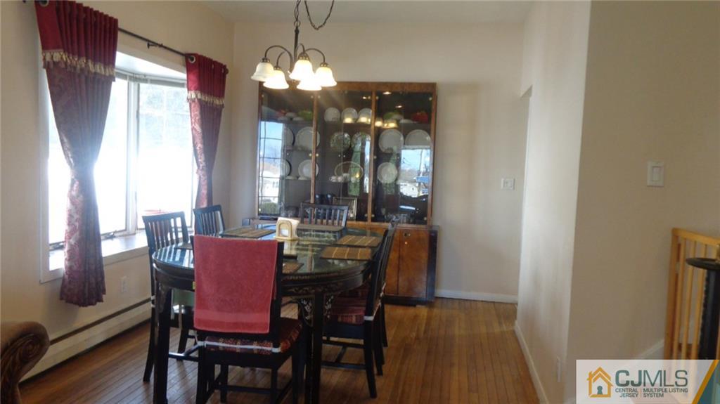34 Brandywine Road Fords, NJ 08863 - Photo 6 of 19 a view of a dining room with furniture and chandelier