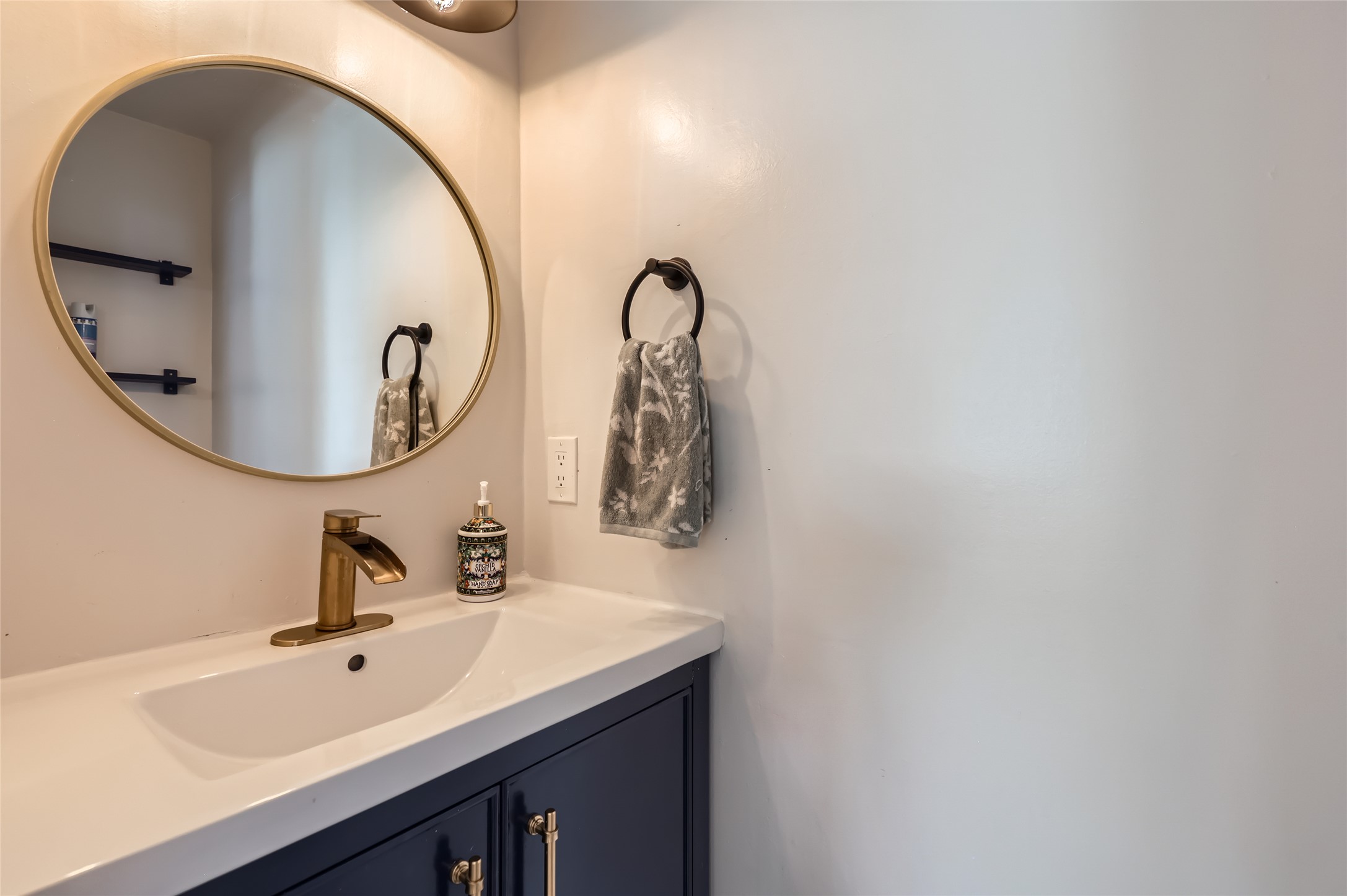 13205 Kepler Cove Austin, TX 78729 - Photo 15 of 34 a bathroom with a sink and mirror