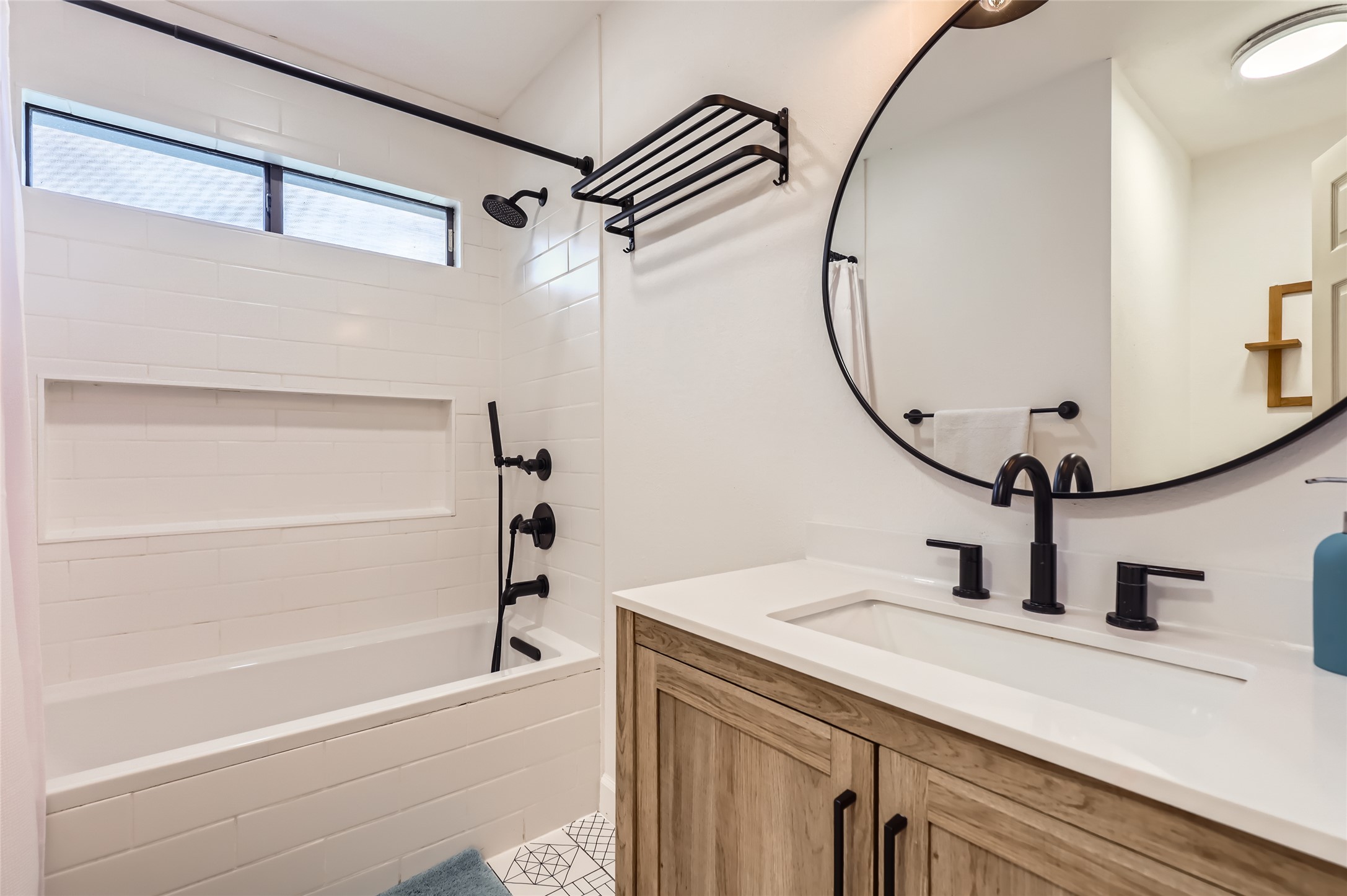 13205 Kepler Cove Austin, TX 78729 - Photo 26 of 34 a bathroom with a sink and a mirror