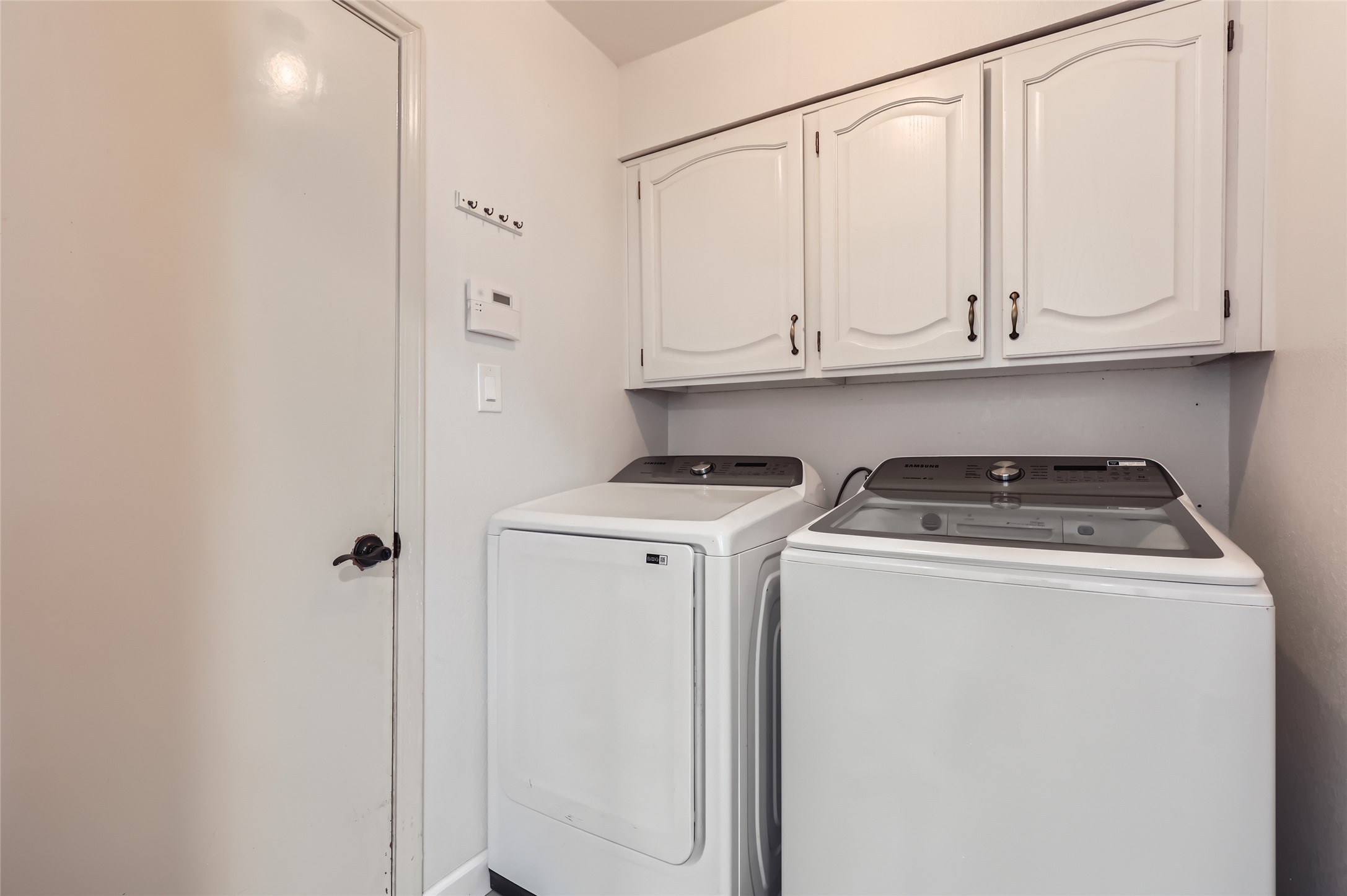 13205 Kepler Cove Austin, TX 78729 - Photo 29 of 34 a utility room with dryer and washer