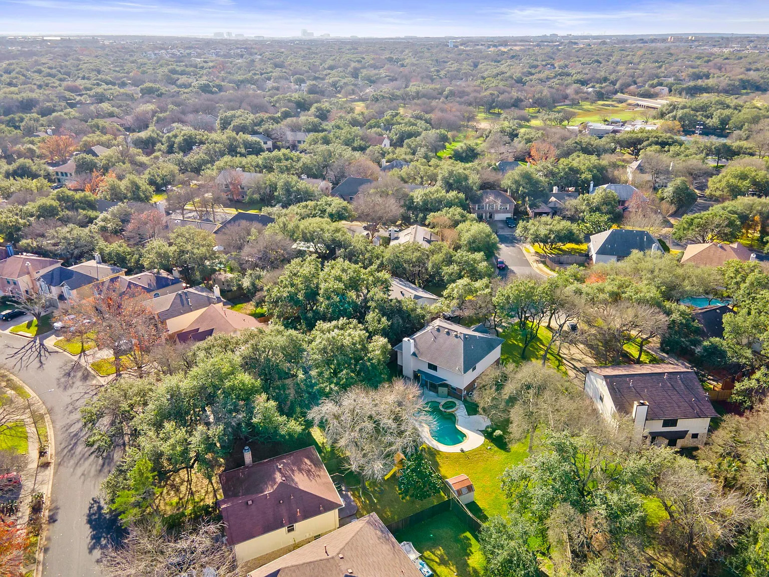 13205 Kepler Cove Austin, TX 78729 - Photo 30 of 34 Aerial perspective showcasing a residential neighborhood with numerous mature trees