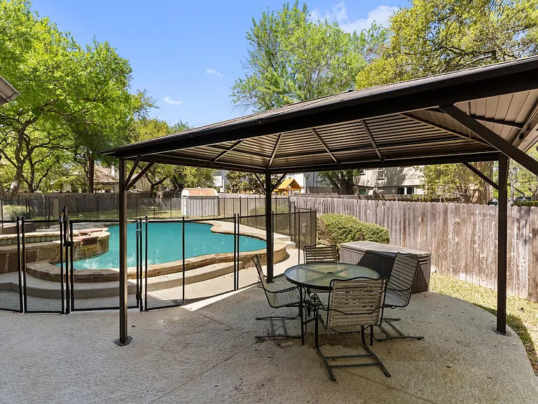 13205 Kepler Cove Austin, TX 78729 - Photo 33 of 34 Outdoor living space featuring a dedicated patio area with an overhead gazebo structure