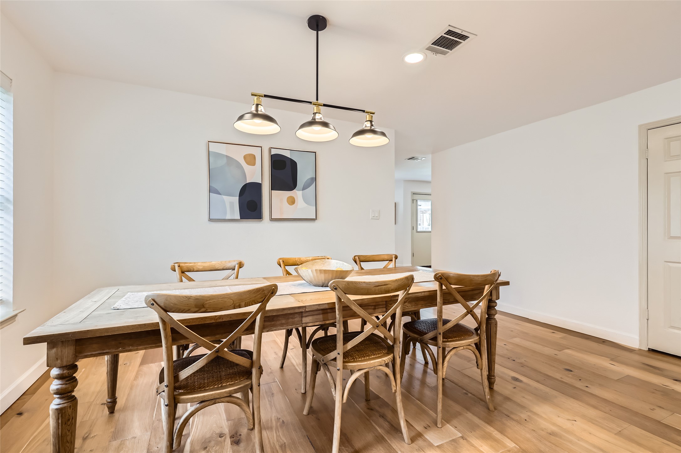 13205 Kepler Cove Austin, TX 78729 - Photo 5 of 34 a view of a dining room with furniture and wooden floor