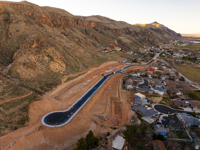 1087 South 160 West Hurricane, UT 84737 - Photo 2 of 4 Developing residential area with newly paved roads, surrounded by established homes and natural mountainous terrain
