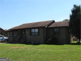 1195 Minter Road Griffin, GA 30223 - Photo 1 of 1 a house view with a garden space