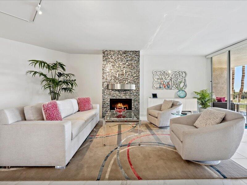 900 Island Drive, Unit 503 Rancho Mirage, CA 92270 - Photo 14 of 31 a living room with furniture and a fireplace